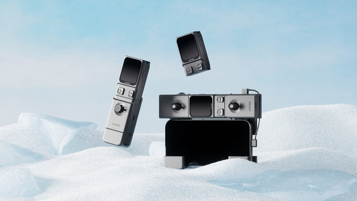 HOVERAir Beacon and JoySticks displayed in a snow environment, featuring standalone use alongside one-handed and two-handed RC controller setups.