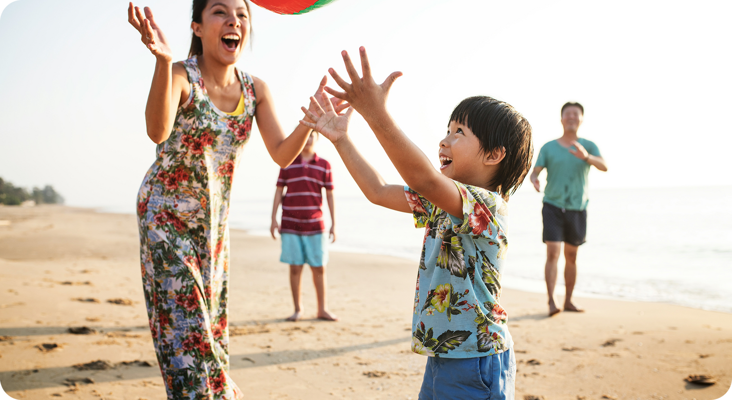 Family playing with a beach ball