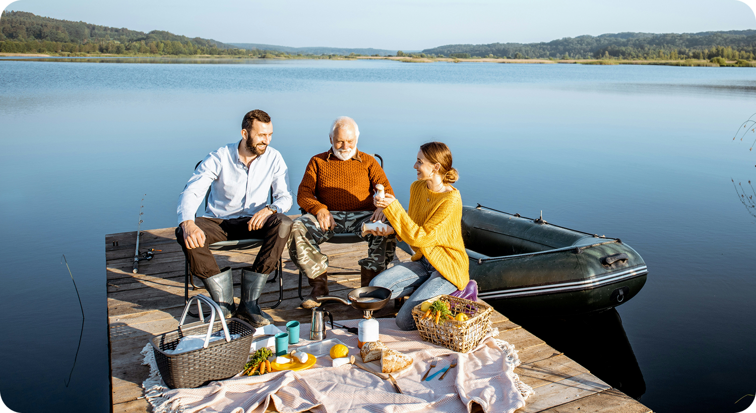 Friends having a picnic on a dock